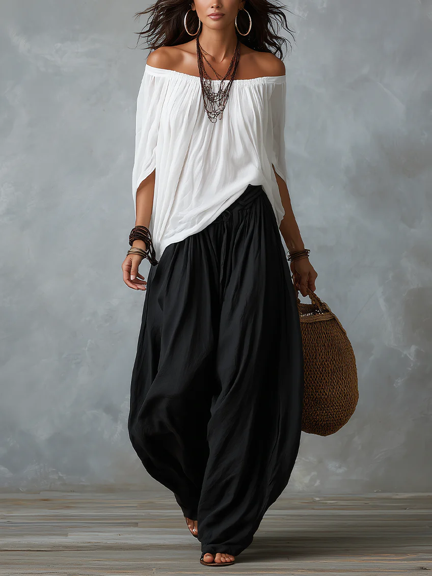 White off-the-shoulder top and flared lantern-style trousers