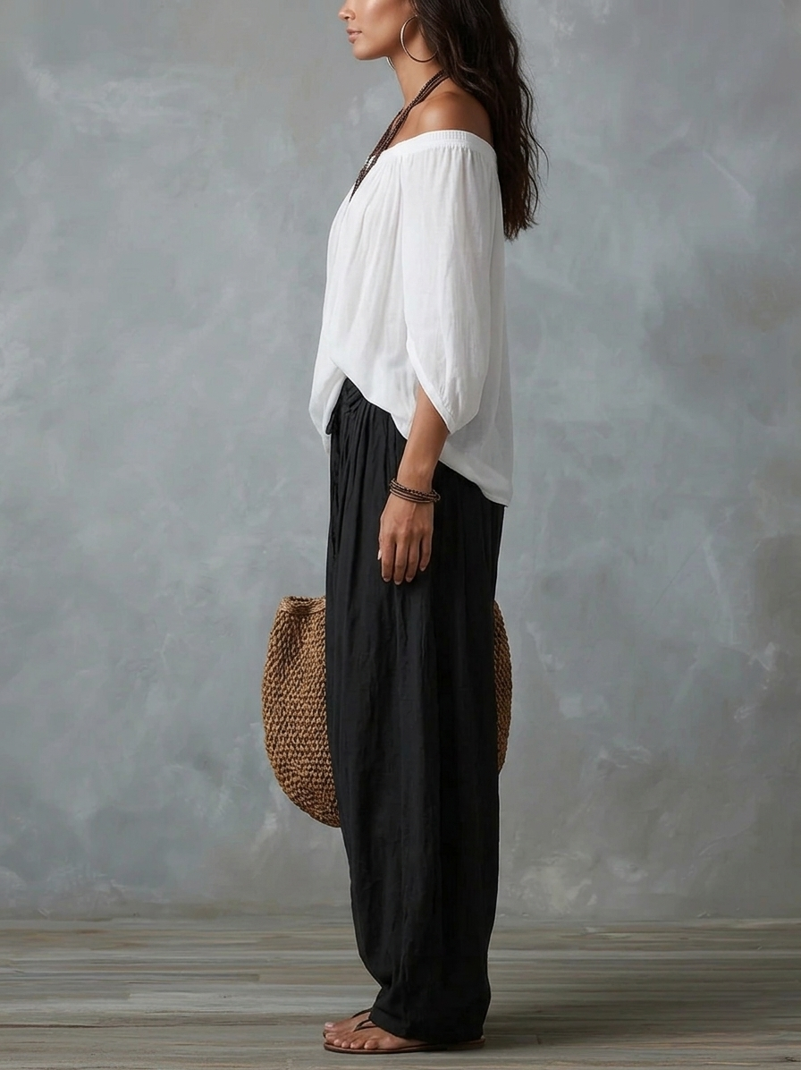 White off-the-shoulder top and flared lantern-style trousers